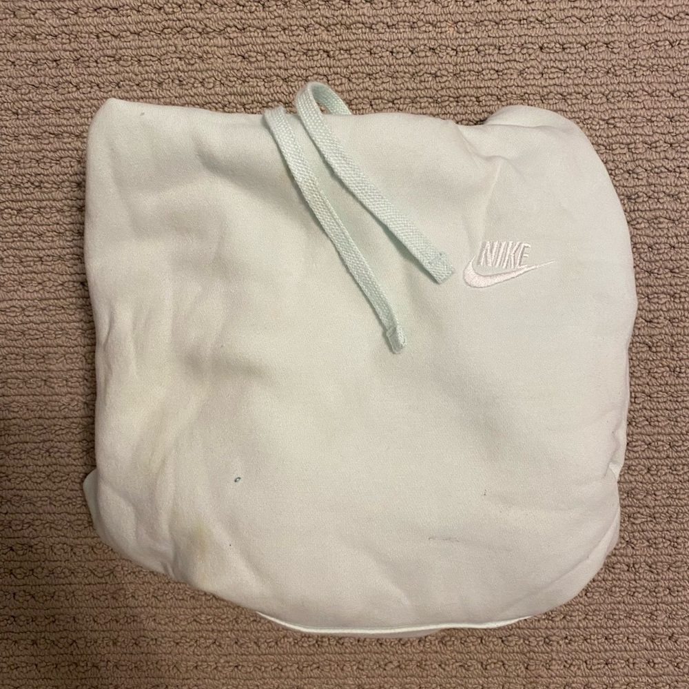 Nike hoodie in a light blue ish green color